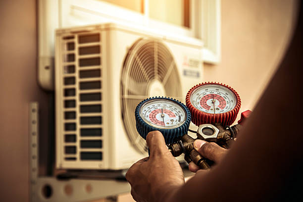 Professional Heat Pump Repair technician working in Alpine, TX